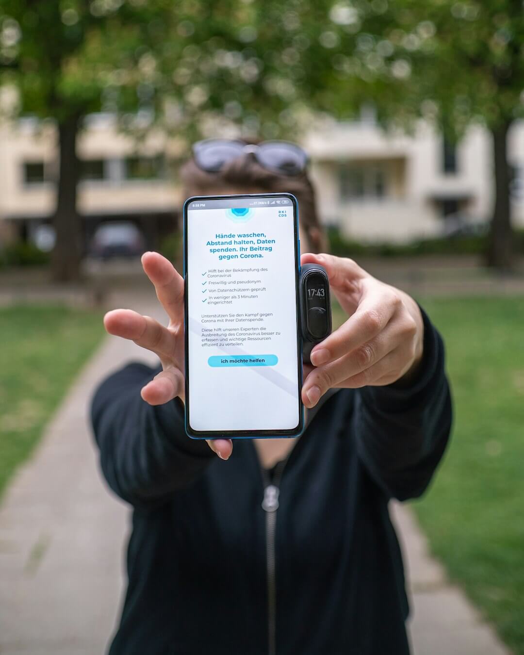 person using silver iPhone Xs