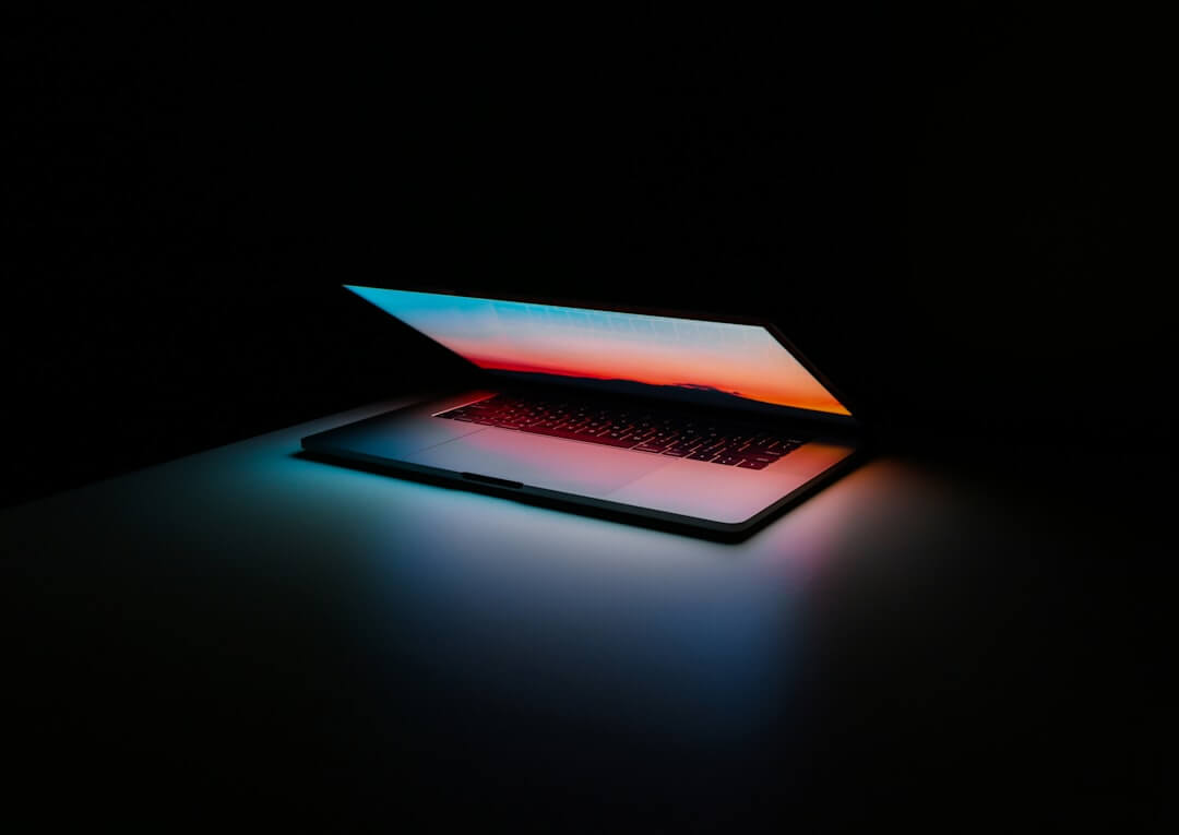 MacBook Pro turned-on on white surface