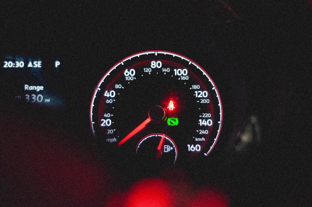 The dashboard of a car at night time