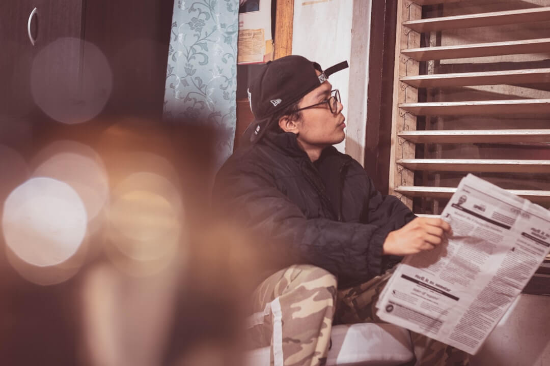 a couple of people that are sitting in front of a camera