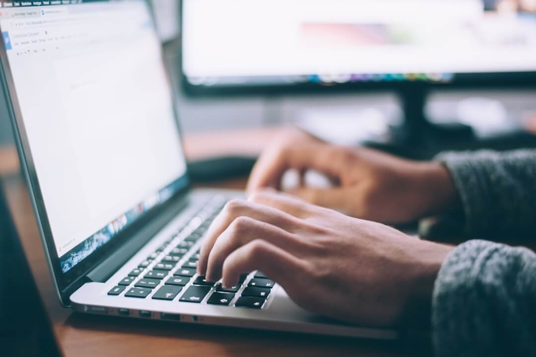 person using black laptop computer