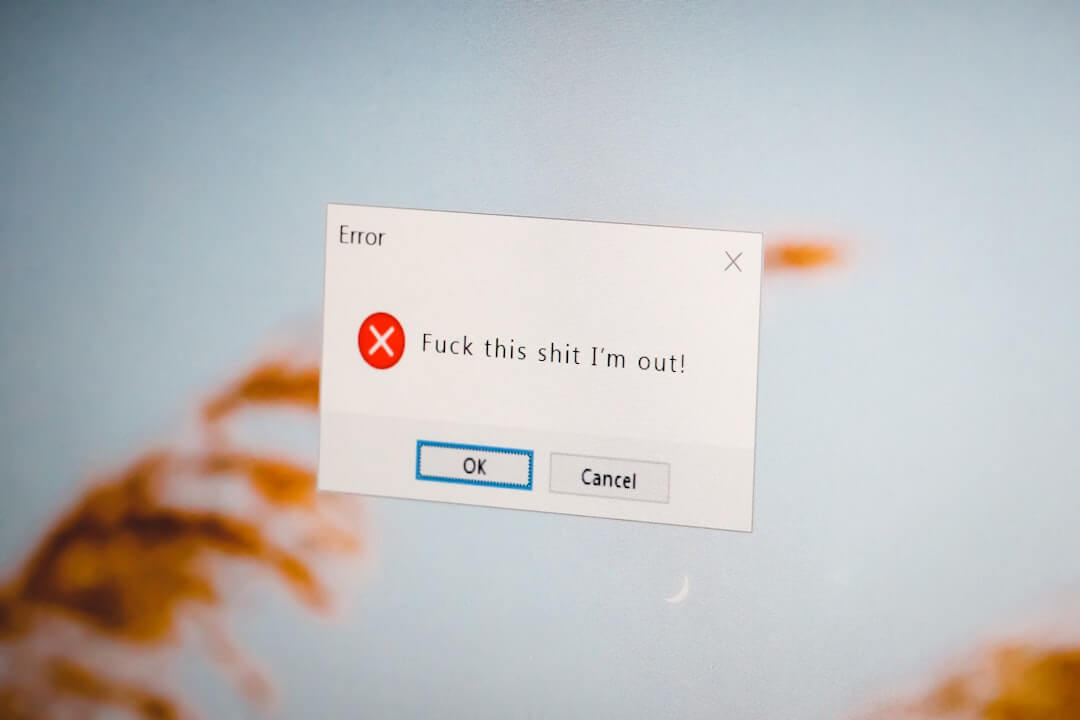 white and red card on white computer keyboard