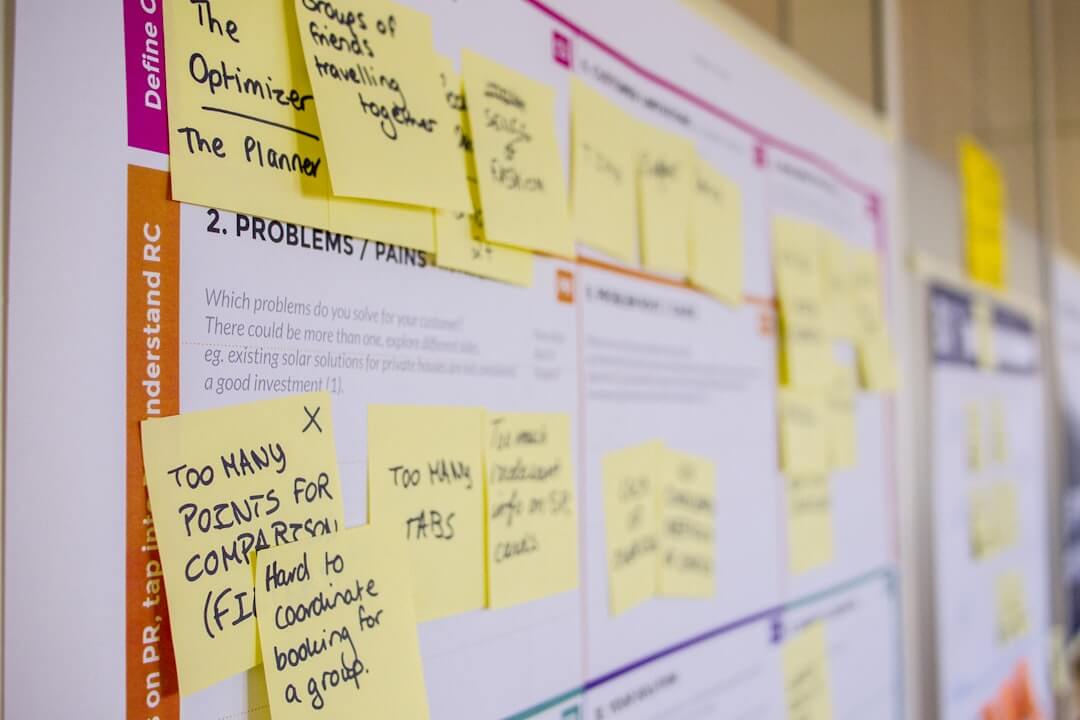 a white board with post it notes on it