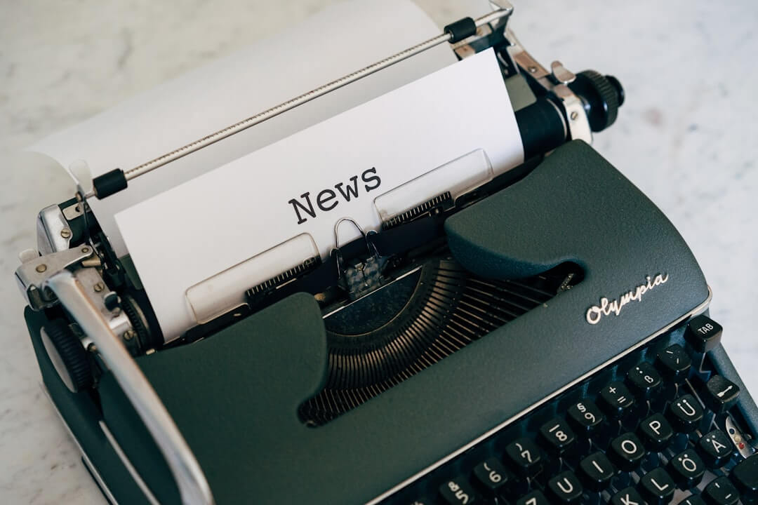 black and white typewriter on black table