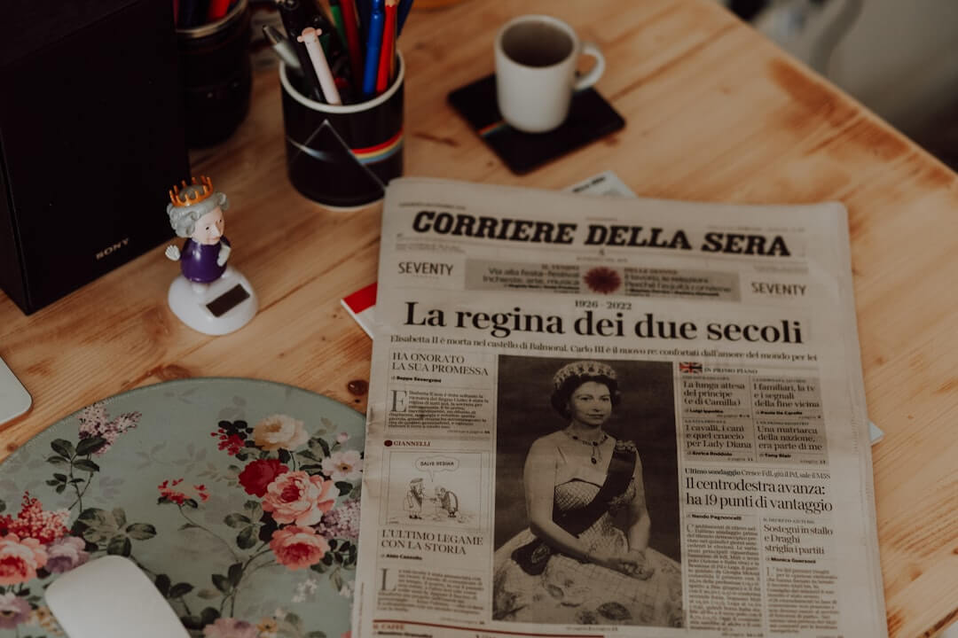 a desk with a computer and papers on it