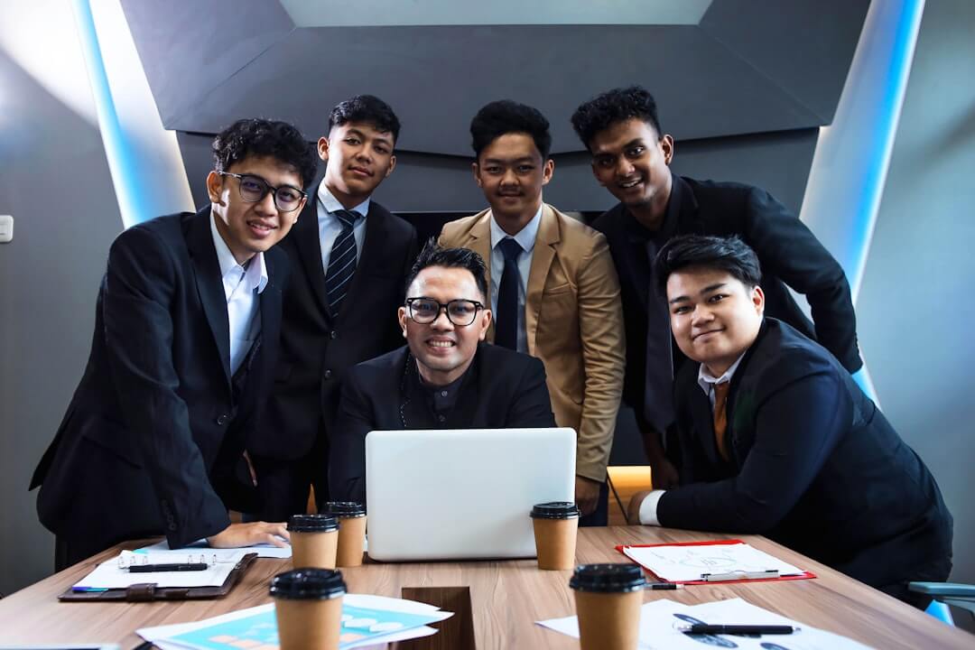woman in blue denim jacket holding white ceramic mug