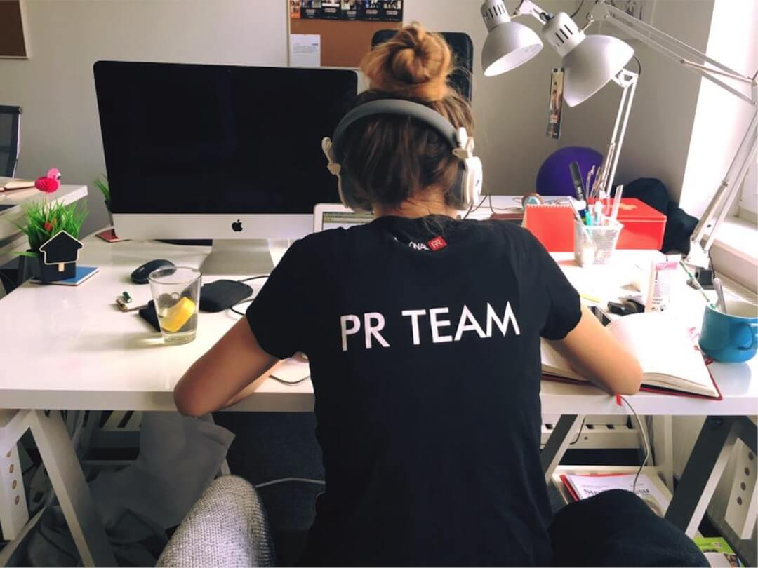 a notepad with a planner and a keyboard in the background
