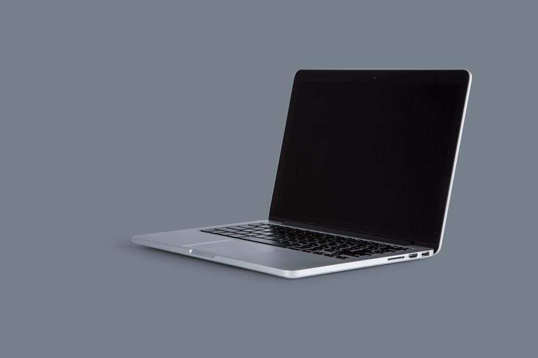 a laptop computer sitting on top of a desk next to a cup of coffee