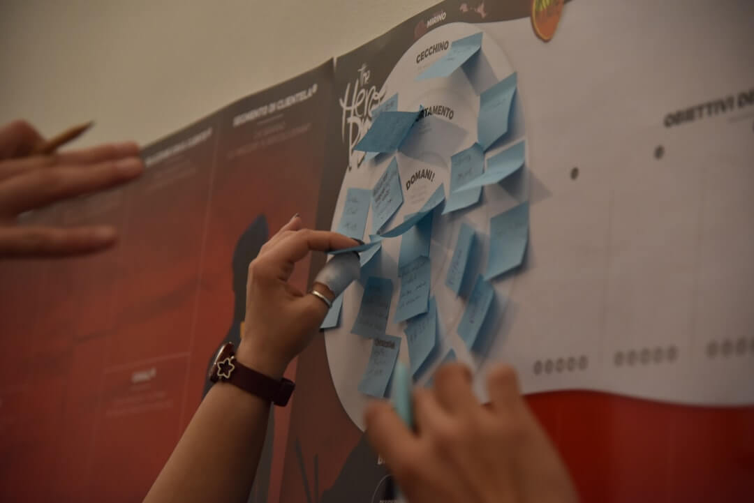 man writing on whiteboard