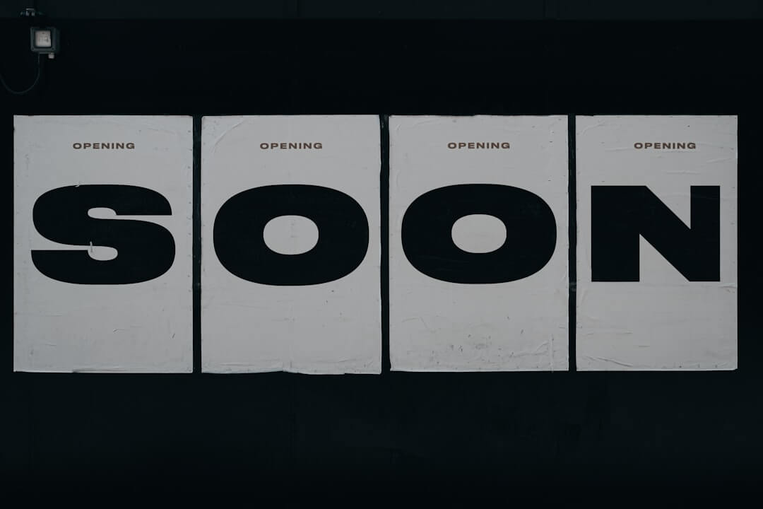 a lighted sign that says refined in a dark room