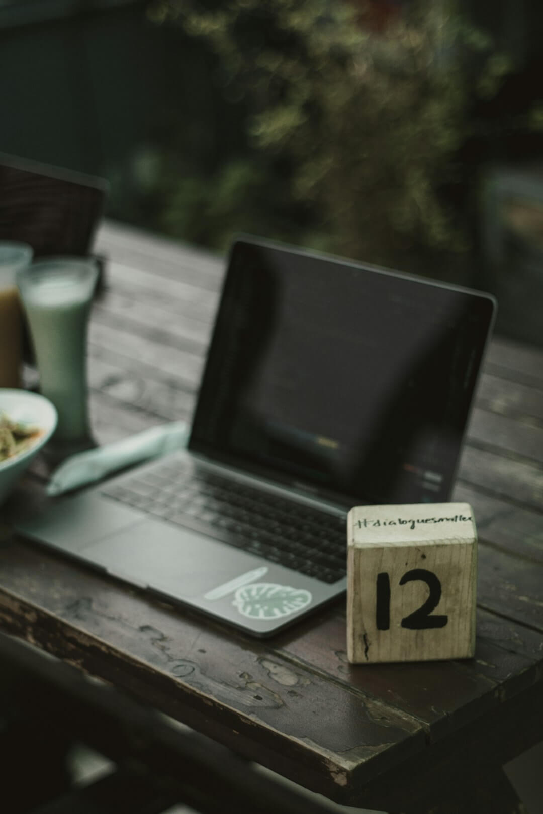 a laptop with a cup of coffee