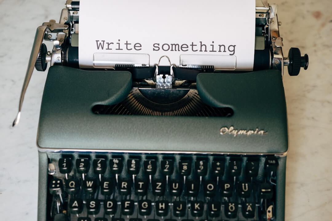 black and white typewriter on white table