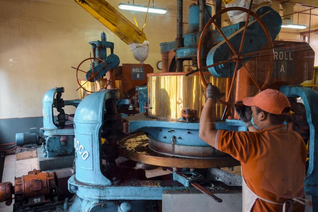 a large red and white machine in a factory