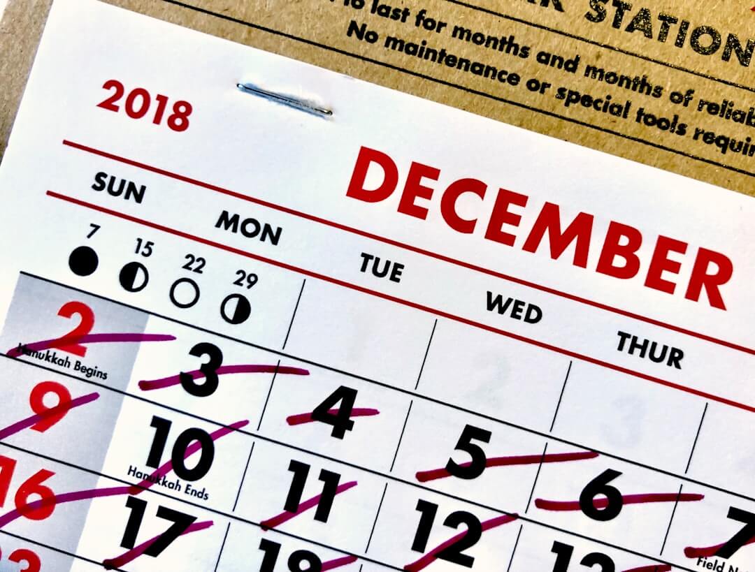 a calendar sitting on top of a wooden table