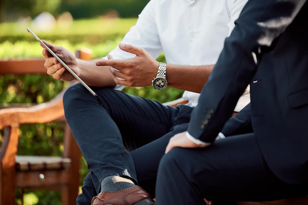 a hand holding a tablet