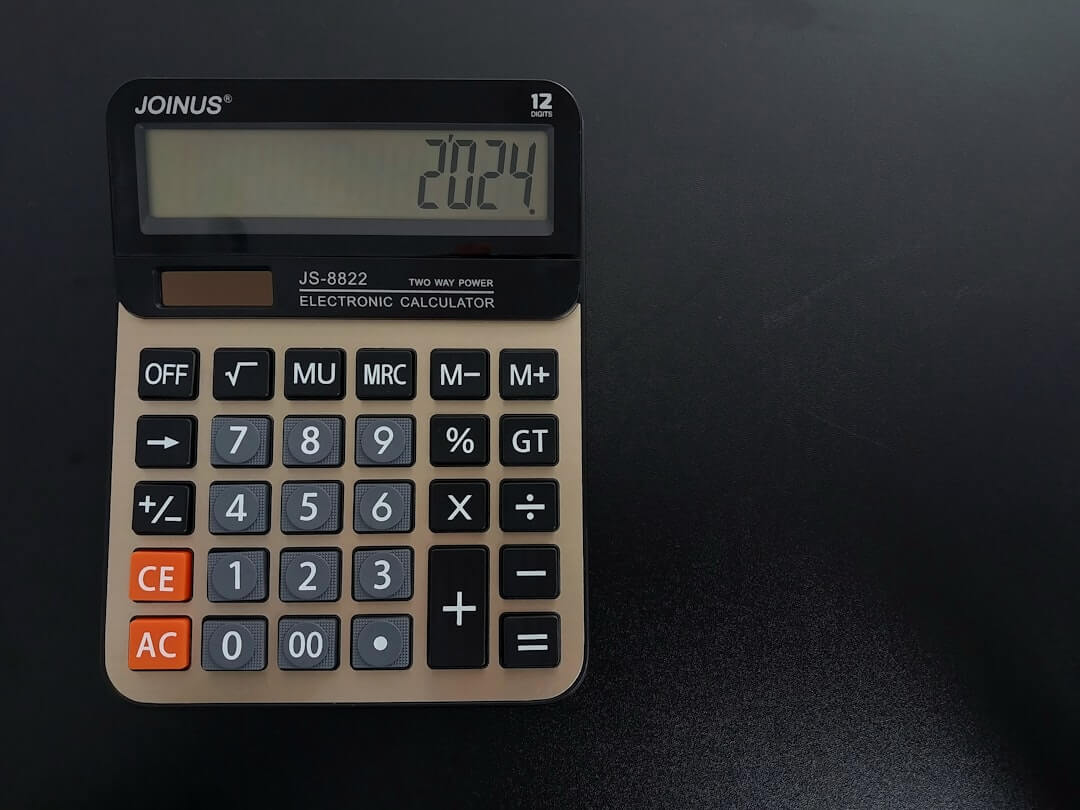 a calculator sitting on top of a wooden table