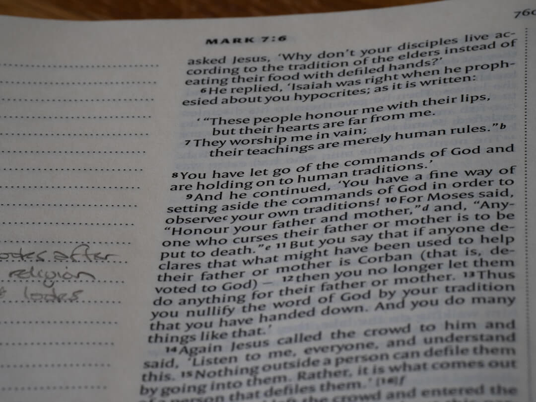 Close-up of an open bible with handwritten notes