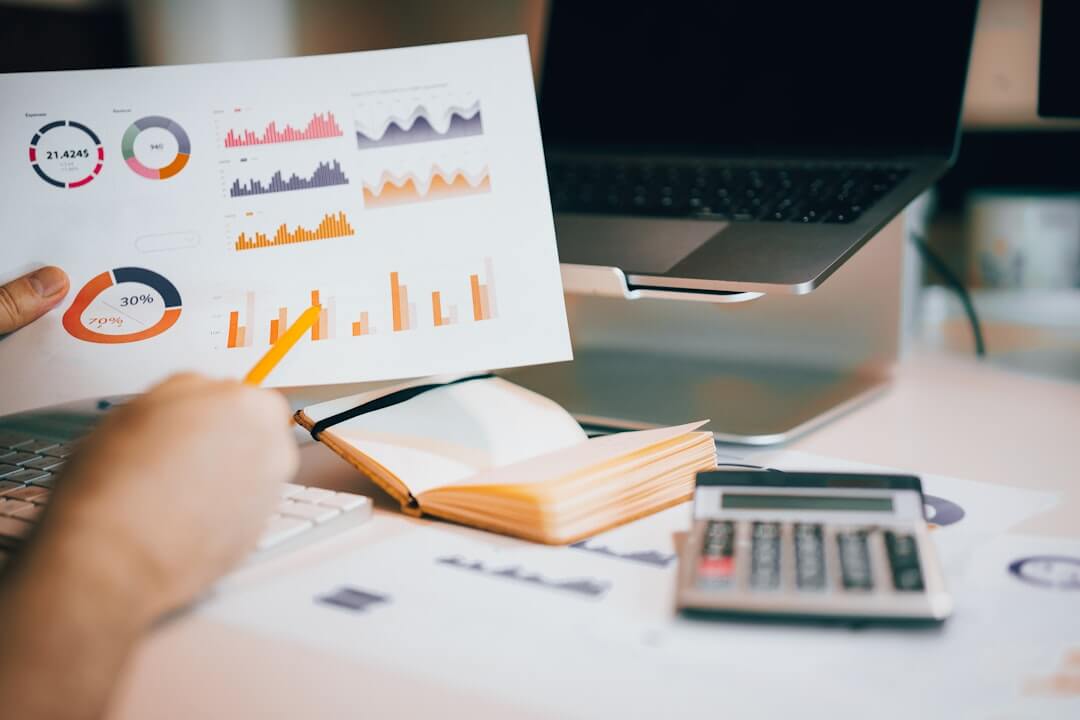 Laptop and phone displaying financial data