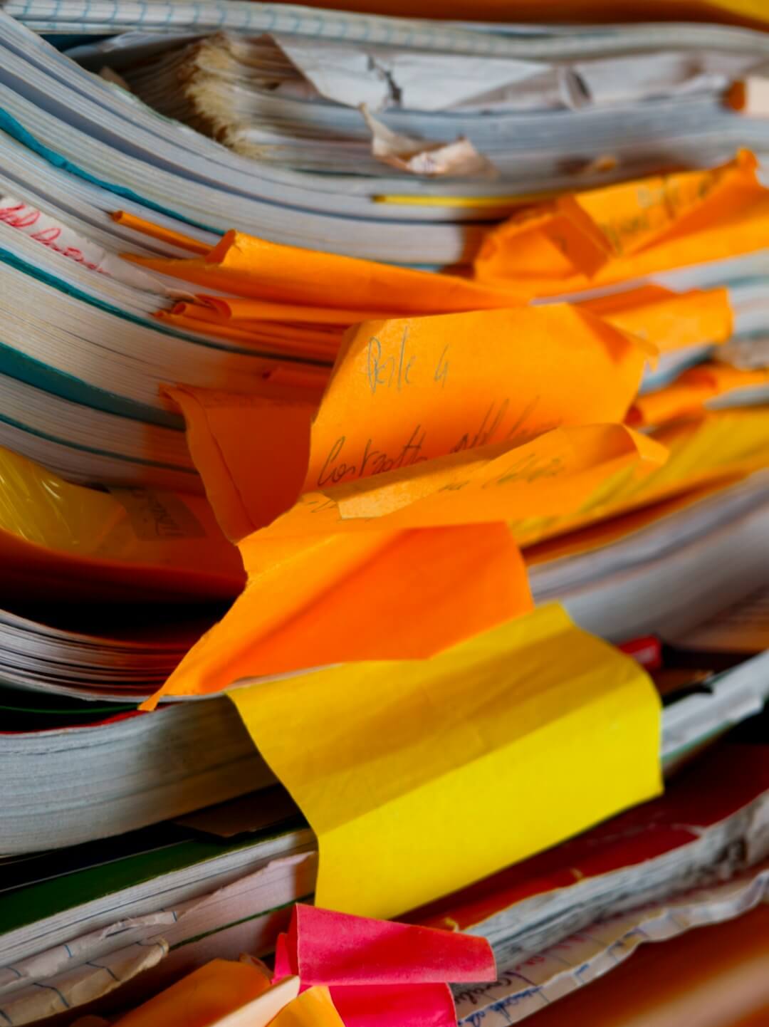 a cluttered desk with papers and a stethoscope