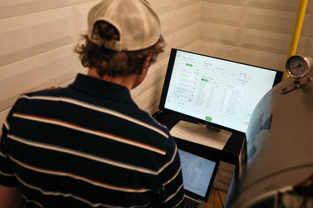 person using computer on table