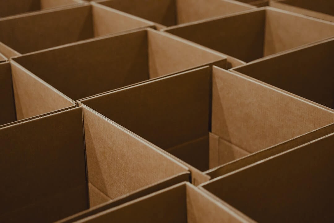 A tall red tower with lots of boxes on top of it