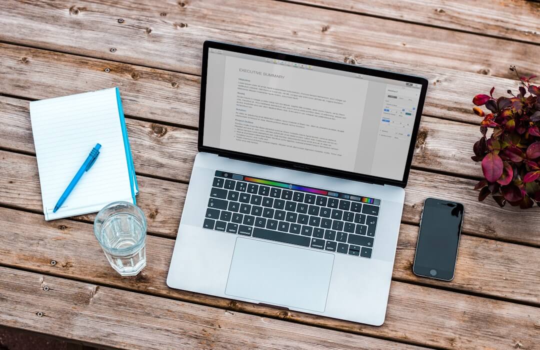 a person typing on a laptop