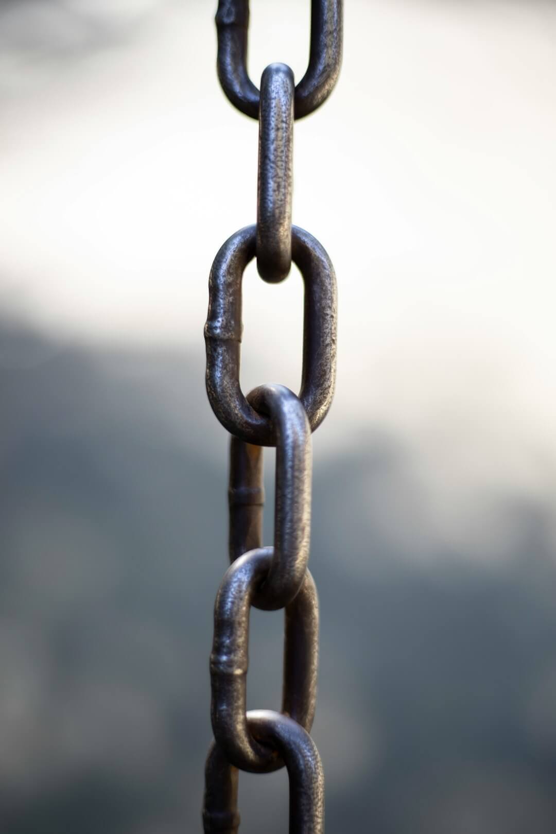 brown metal chain with white background