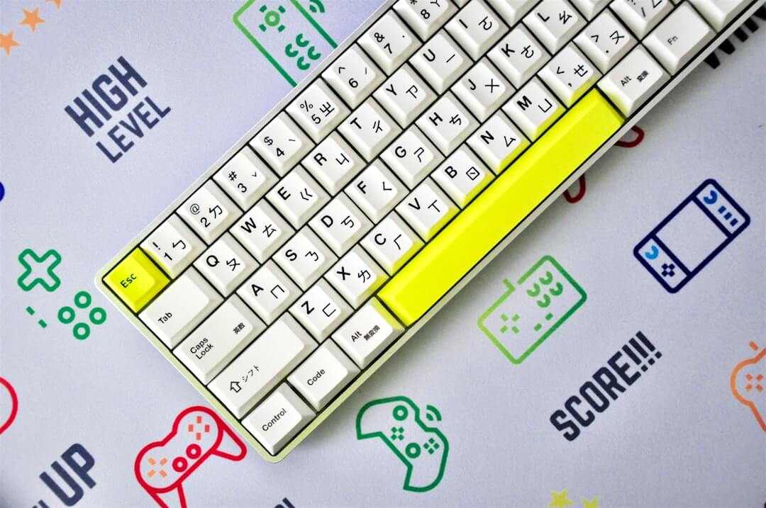 a keyboard with a yellow sticker on it