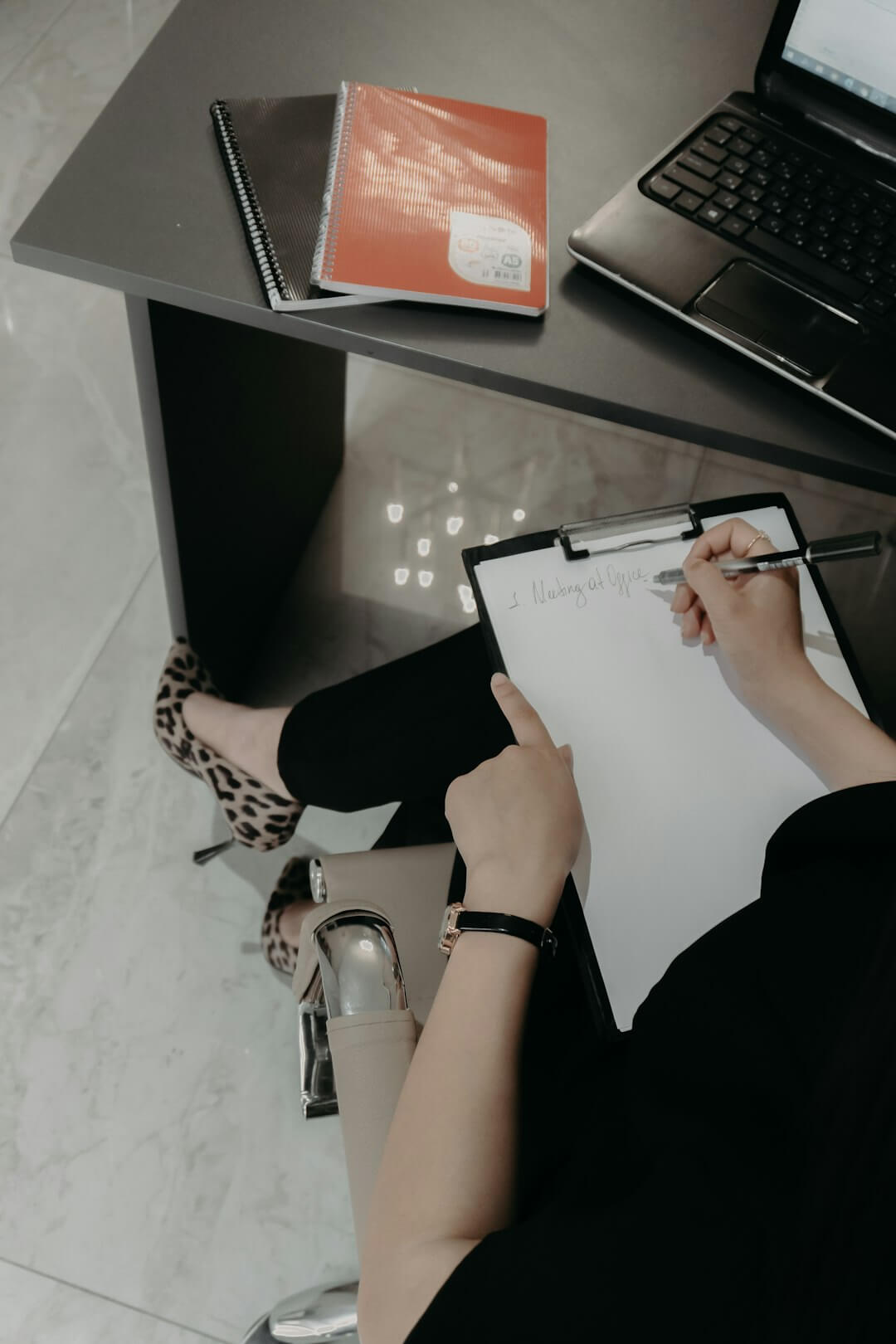 Man in glasses reviewing documents at desk