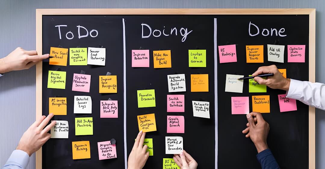a man and a woman standing in front of a white board