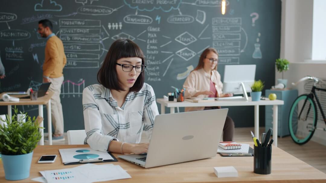 Woman celebrating success while on a business call.